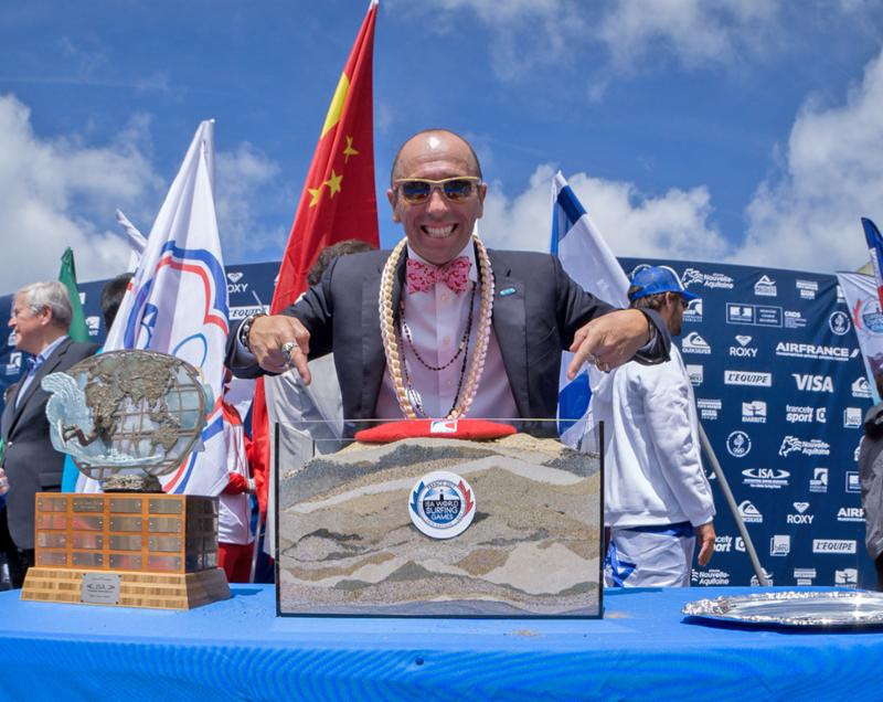 ISA President Fernando Aguerre displays the sand of 47 nations at the 2017 ISA World Surfing Games in Biarritz, France. Photo: ISA /Sean Evans