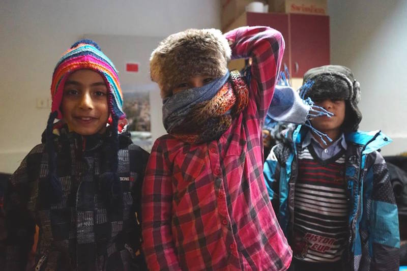 Riders for Refugees_refugee children in their warm clothing_by Alexis de Tarade