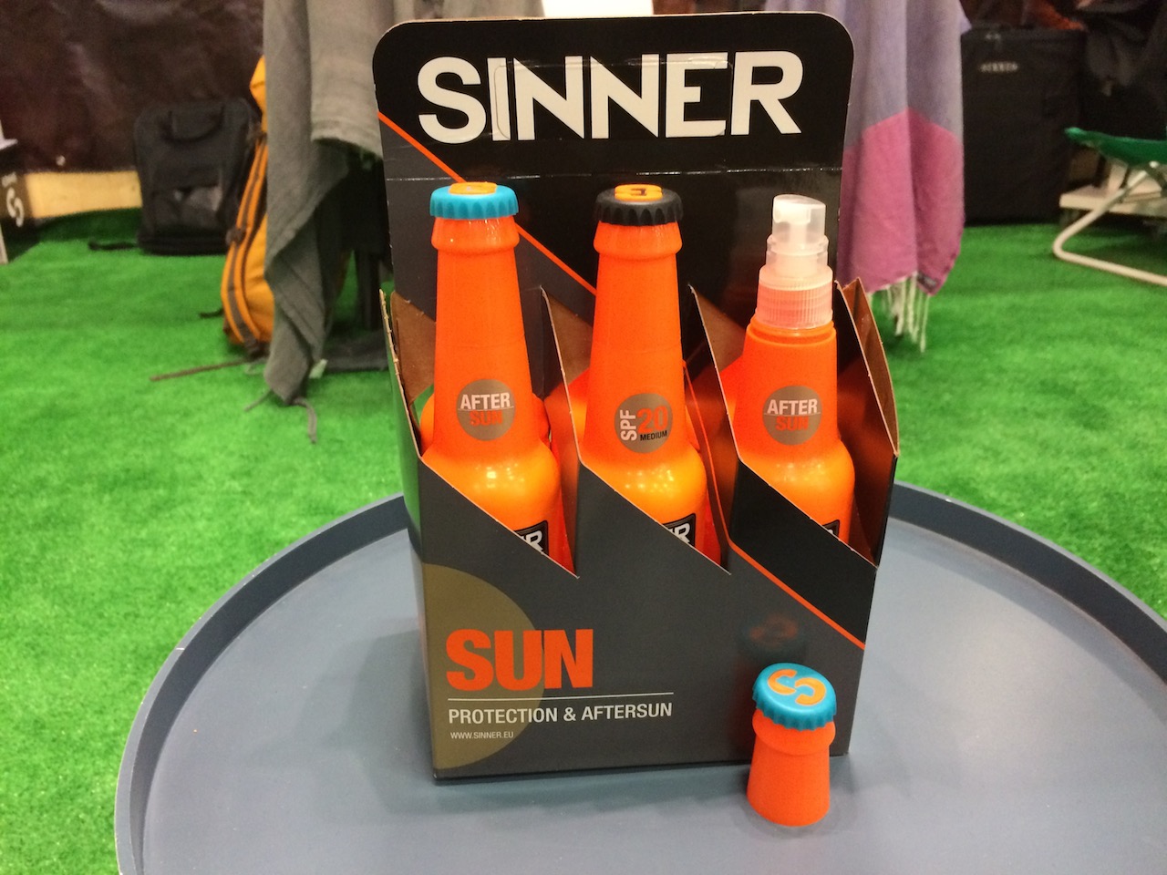 Sinner’s sun protection in a dayglo beer bottle