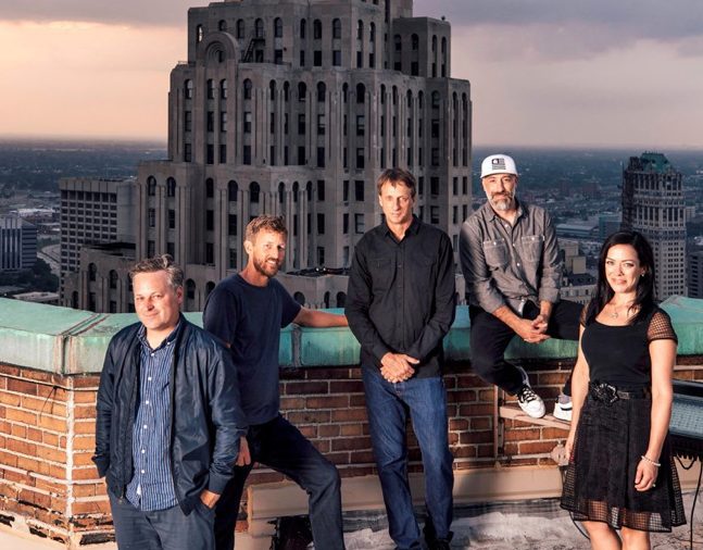 From left: D/CAL co-founders Ryan Maconochie, Jared Prindle, Tony Hawk and Adam Wilson with Katherine Huber, director of client services, atop the Guardian Building in downtown Detroit, where they have an office for their new agency.