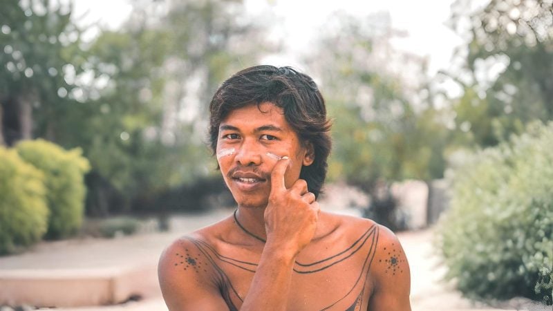 Zinc White - Man applying zinc on beach indonesia tropics - Suntribe Reef Safe Mineral Sunscreen@Marjos_Stories